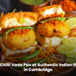 Cheesy and chilli vada pav served fresh at an authentic Indian restaurant in Cambridge
